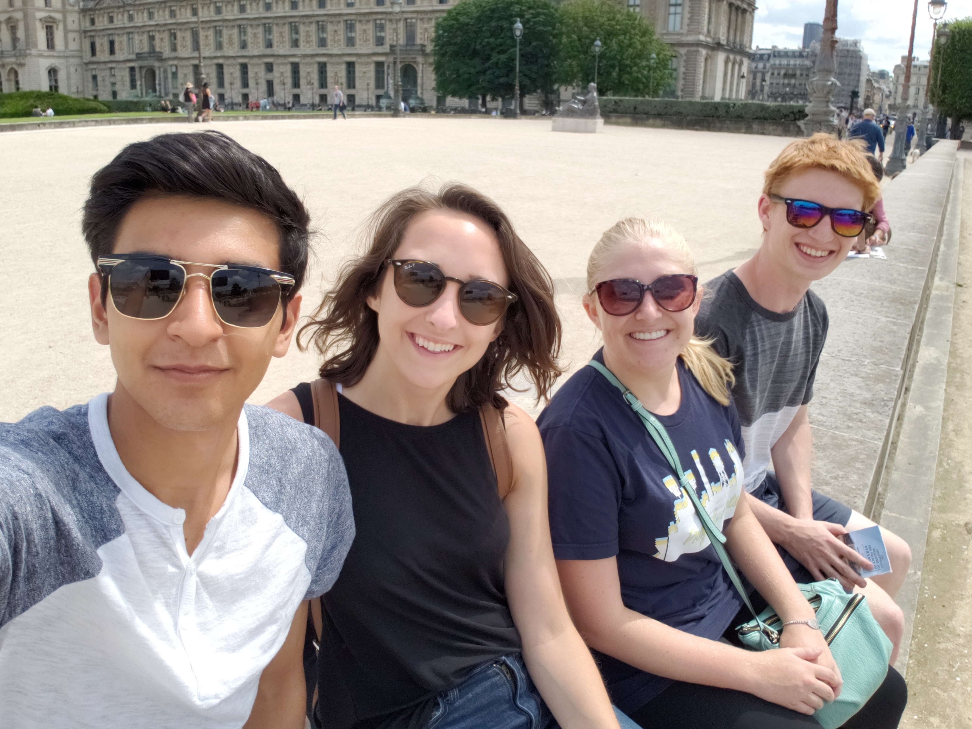 Me (Far Left), Kayley, Anna and Ben taking a break outside the Louvre in Paris.