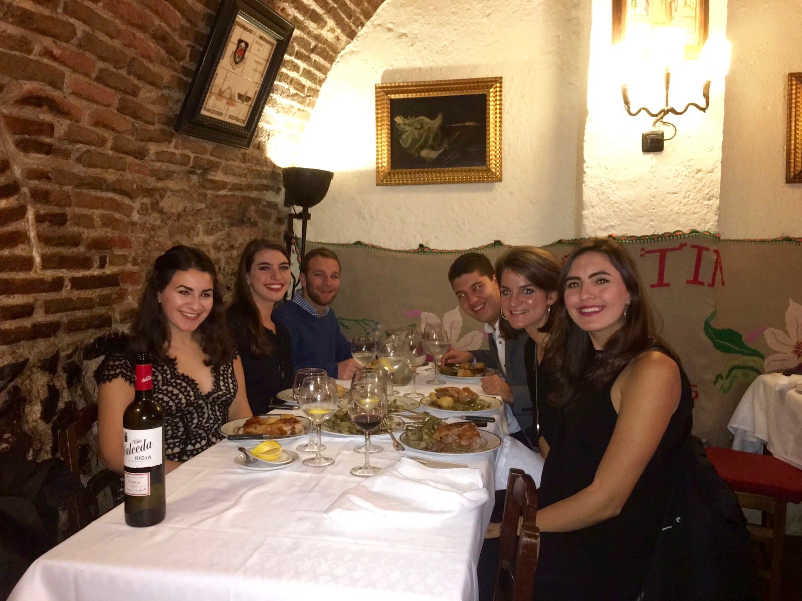 Katherine and some friends toward the end of their semester, eating cuchinillo at the oldest restaurant in the world, where Hemingway loved to go.