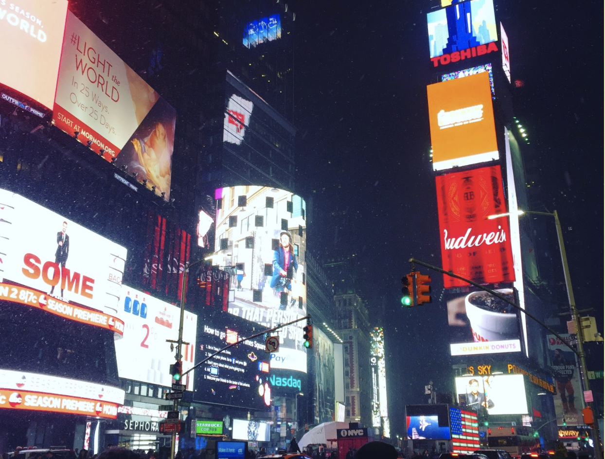 The first snowfall of winter in Times Square