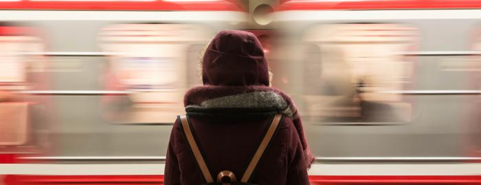 Person in front of a fast moving train