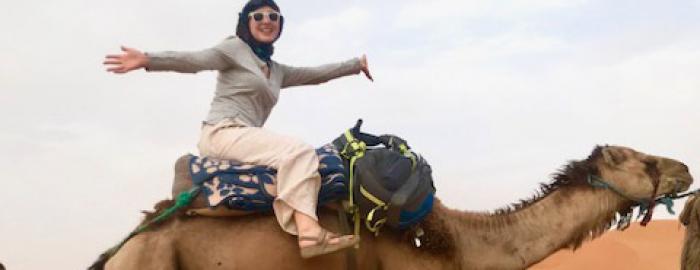 Bailey Carkenord on a camel