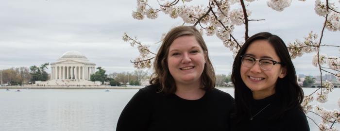 Joyce and a friend standing near a Cherry blossom tree