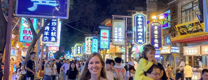 Sanna standing on a street in China