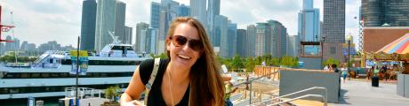 photo of student in front of Chicago skyline