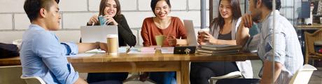 students having a meeting in modern office