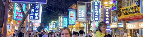 Sanna standing on a street in China