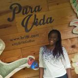 Cassia Caruth in front of a Pura Vida sign